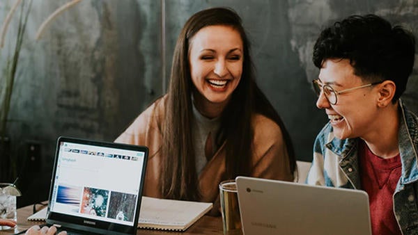 students at a table (c) unsplash