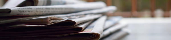 stack of newspapers (c) pexel